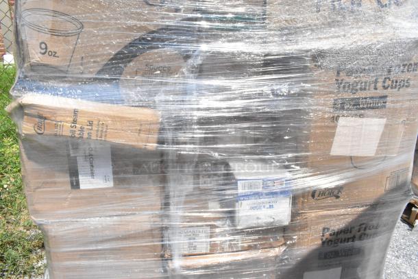 Shrink-wrapped pallet of scratch and dent items, including to-go containers, t-shirt bags, baking molds, and disposable plates.