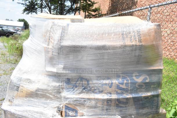 Pallet wrapped in plastic containing scratch and dent to-go containers, salt/pepper, T-shirt bags, baking molds, and disposable plates.