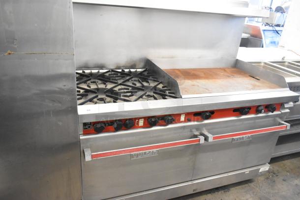 Vulcan stainless steel commercial gas range featuring four burners, right-side flat top griddle, convection and standard oven, with over shelf and backsplash.