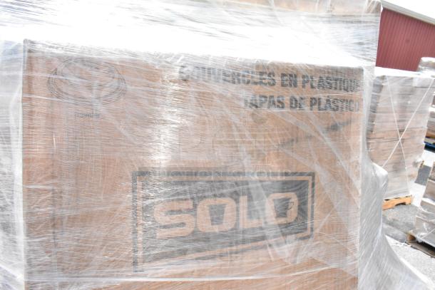 Plastic-wrapped pallet labeled "SOLO" containing scratch and dent items like foam cups and aluminum foil, 15 item lot.