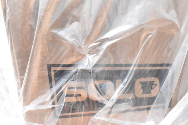 15 new scratch and dent items, including SOLO foam cups and aluminum foil, wrapped in plastic.