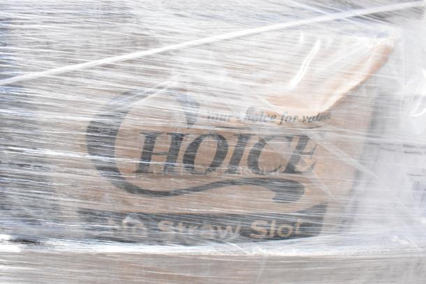 Transparent plastic-wrapped pallet labeled "Choice," containing assorted scratch and dent items, including plastic plates.
