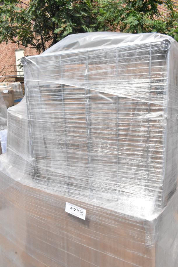 Plastic-wrapped pallet of 20 brand new scratch and dent items, including plastic plates. Visible label reads "312 ¾ QTY 120."