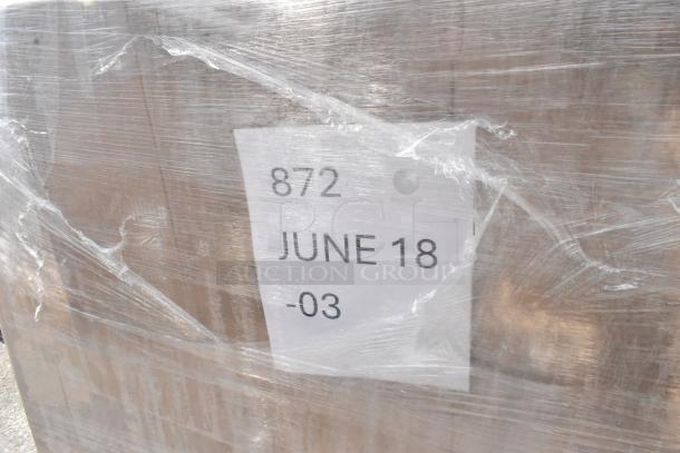 Pallet wrapped in plastic, showing a label with "872 JUNE 18 -03." Contains 20 new scratch and dent items: plastic tumblers, to-go containers, speed rail.