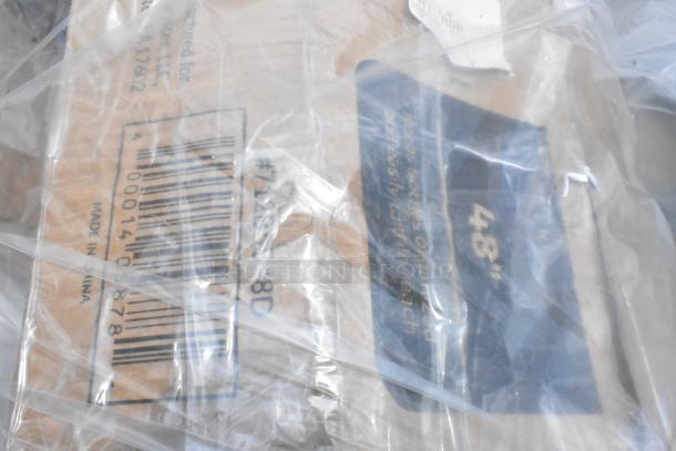 Close-up of wrapped packaging with barcodes and text reading "Made in China" and "48." Items are scratch and dent.