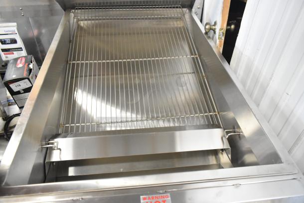 Brand new Avalon AFG34T-H 24" x 34" stainless steel donut glazer with under shelf, on commercial casters. 120V, 1 Ph.
