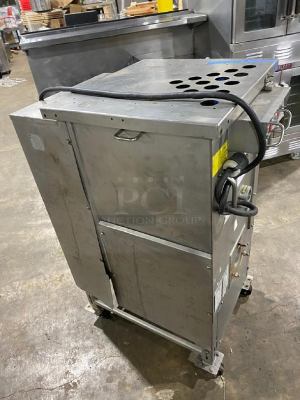 Biro commercial electric meat mixer/grinder on casters, stainless steel, automatic feed, good condition, visible power cord.