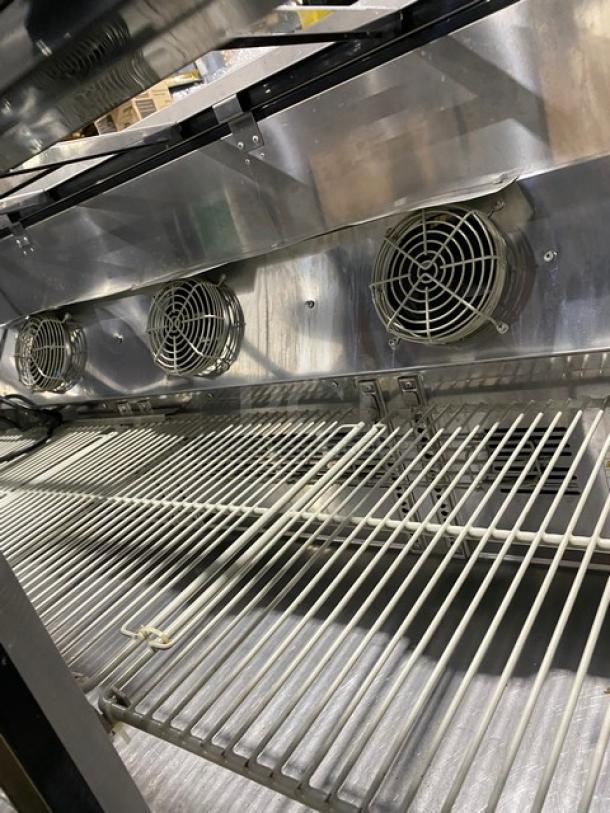 Turbo Air JBT-72-N refrigerated salad bar with poly coated wire racks, stainless steel, sneeze guard, on casters.