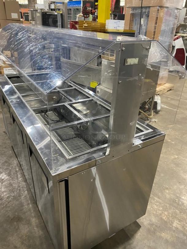 Turbo Air 3-Door Stainless Steel Buffet Cold Food Display Table, Model JBT72N, with sneeze guard and poly-coated wire racks.