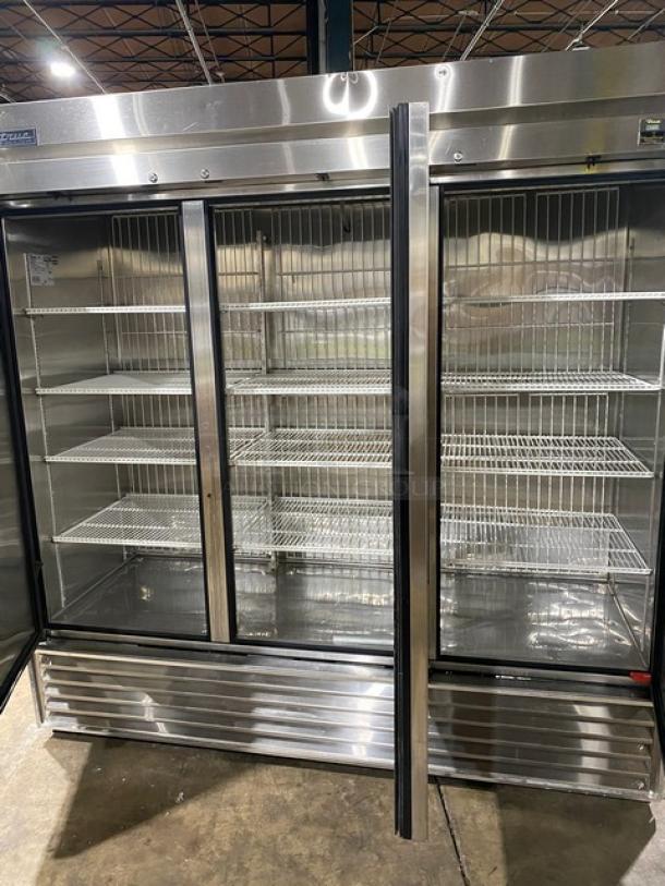True TS-72F commercial stainless steel 3-door reach-in freezer with poly-coated wire racks, in excellent condition.
