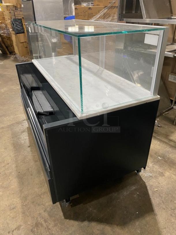 Structural Concepts black multi-level refrigerated grab-n-go display case, model SBZ6652DR, with top glass showcase, 220V, on legs.