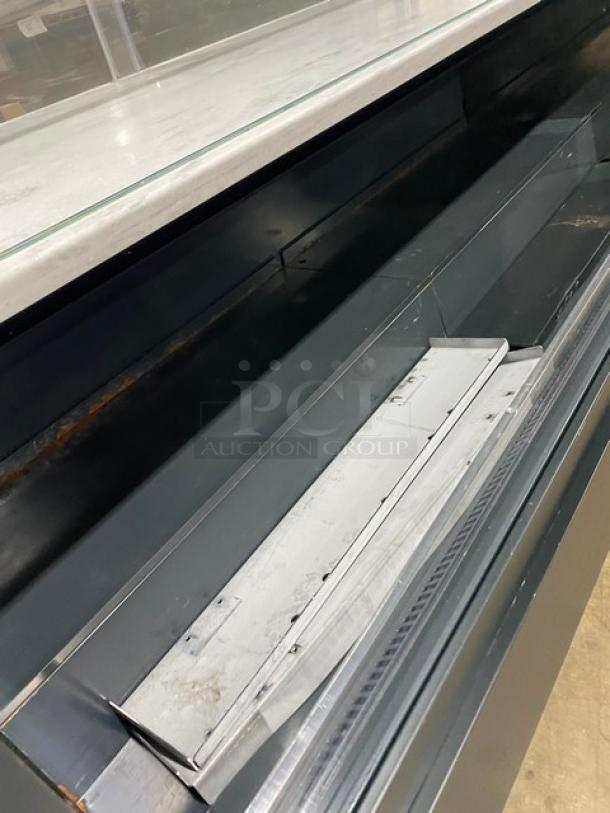 Structural Concepts Model SBZ6652DR multi-level refrigerated display case, black, with glass showcase, 220V, on legs.