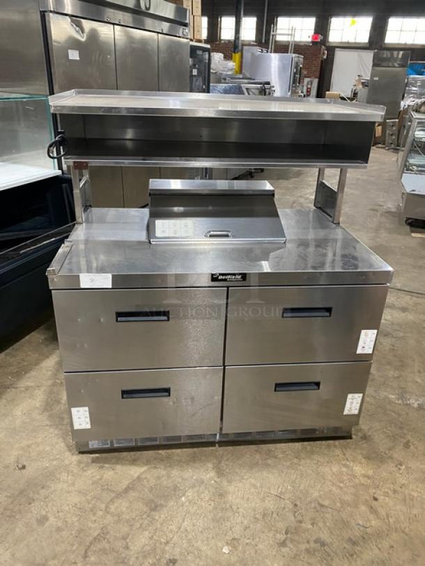 Delfield stainless steel 4-drawer refrigerated prep table with enclosed overhead storage. Ideal for salad/sandwich prep.