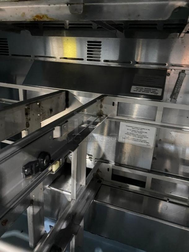 Delfield Commercial Stainless Steel Prep Table interior showing frame structure and label details, emphasizing durability.