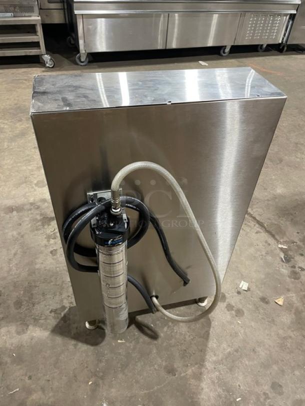Fetco CBS52H15 stainless steel twin coffee brewer with hot water dispenser, 240V 1-phase, on legs, seen from the back.