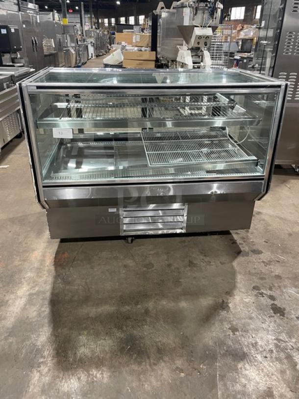 Leader CBK57 refrigerated bakery display case, 57" stainless steel with straight glass, adjustable wire racks, 115V, 1 phase.