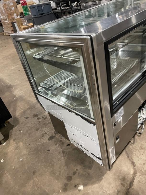 Leader CBK57 stainless steel bakery display case, 57", straight glass, adjustable wire racks, 115V, 1 phase, used condition.
