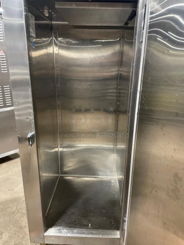 Traulsen commercial stainless steel single door reach-in freezer, model RLT132WUT-FHS, Energy Star certified, on legs.