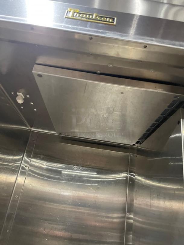 Traulsen RLT132WUTFHS stainless steel reach-in freezer, Energy Star certified, single door, on legs, clean interior.