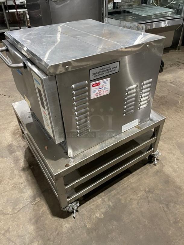 TurboChef NGC stainless steel ventless rapid cook oven, digital controls, on double undershelf equipment cart with casters.