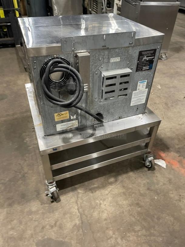 TurboChef NGC stainless steel rapid cook oven on double undershelf cart. Features digital controls, 208/230-240V, on casters.