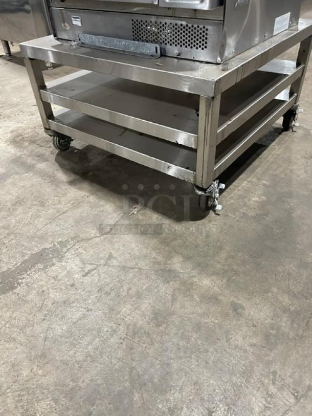 TurboChef NGC ventless rapid cook oven on double undershelf equipment cart. Stainless steel, digital controls, on casters.