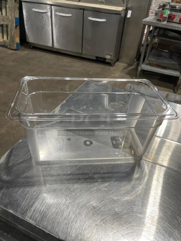 Cambro Camwear 1/3 Size 6" Deep Clear Polycarbonate Food Pan, Model 36CW135, new condition, on stainless steel surface.