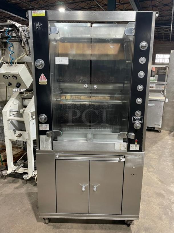 Rotisol 950.5 stainless steel rotisserie oven, natural gas, tempered glass doors, enclosed cabinet base, pull-out workstation, on casters.