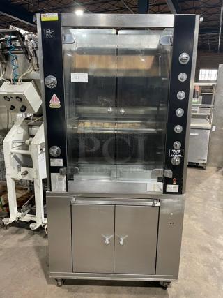 Rotisol 950.5 stainless steel rotisserie oven, natural gas, tempered glass doors, enclosed cabinet base, pull-out workstation, on casters.