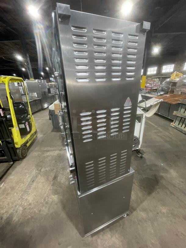 Rotisol Model 950.5 stainless steel rotisserie oven with glass doors, cabinet base, pull-out workstation, on casters, SN: 3798.