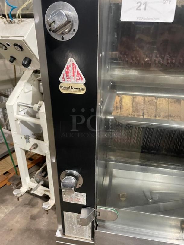 Rotisol 950.5 rotisserie oven, stainless steel, tempered glass doors, enclosed cabinet base, retractable workstation, on casters.