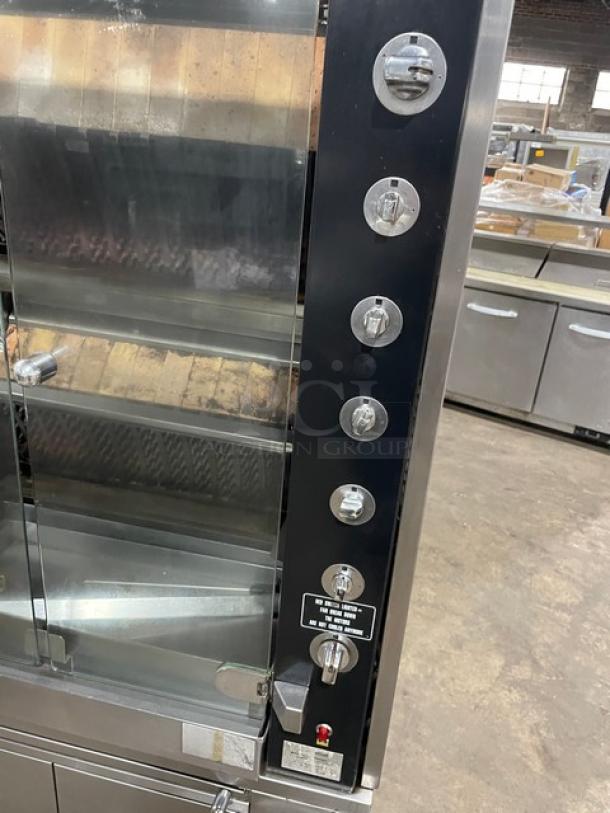 Rotisol 950.5 stainless steel rotisserie oven, natural gas, tempered glass doors, enclosed cabinet base, retractable workstation.