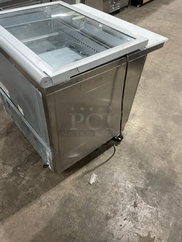 Beverage-Air stainless steel 2-door refrigerated prep table, model SPE36HC-15M-STL, with glass top, cutting board, on casters.
