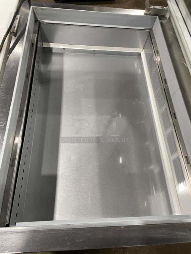Beverage-Air SPE36HC-15M-STL stainless steel 2-door refrigerated prep table with glass top and cutting board, on casters.