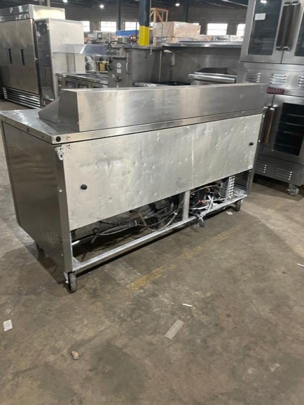 True TSSU-72-18 refrigerated prep table, stainless steel, 3 doors, bain marie style, on casters, used condition.