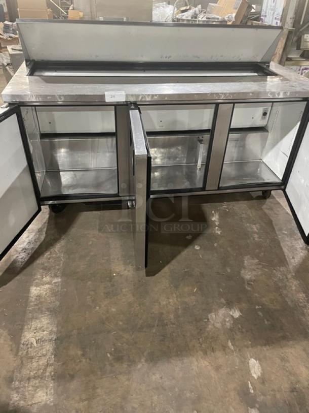 True TSSU-72-18 refrigerated prep table, 3 stainless steel doors, bain marie style, on casters, used condition.