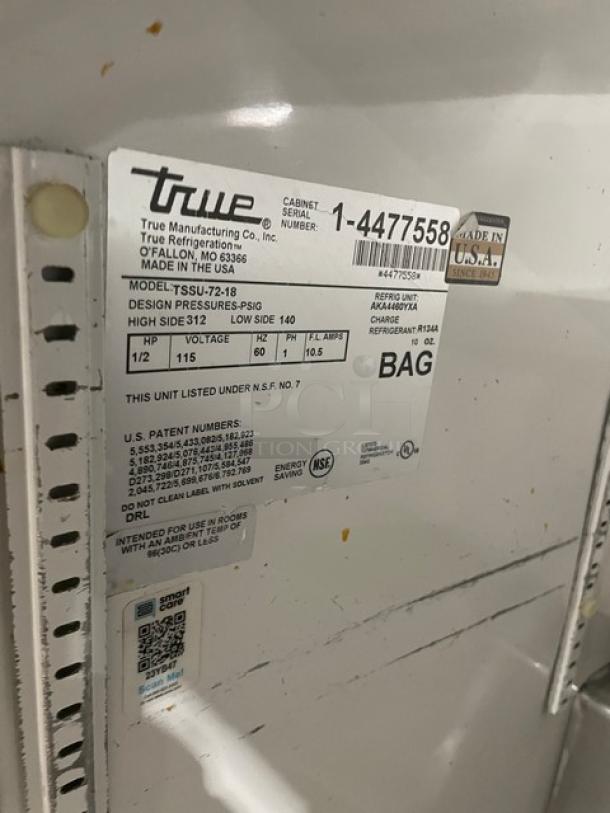 True commercial stainless steel refrigerated prep table, model TSSU-72-18, SN 1-4477558, 115V, on casters, mint condition.