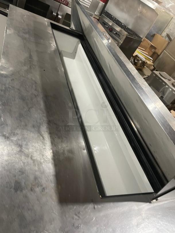 True TSSU-72-18 stainless steel refrigerated prep table, bain marie style, with 3 doors and on casters. Excellent condition.