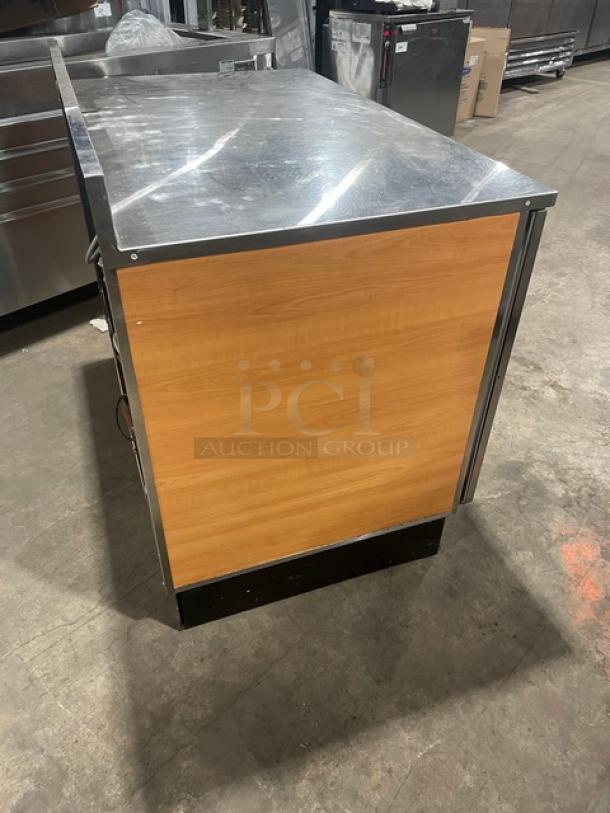 Duke RUF-48M stainless steel 2-door bar counter, Energy Star certified, with up-turned backsplash and poly coated wire racks.