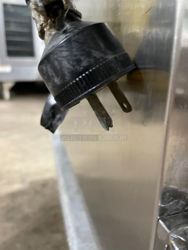 Henny Penny HC900 electric heated holding cabinet plug detail, stainless steel, with visible wear, 120V 1 Phase.