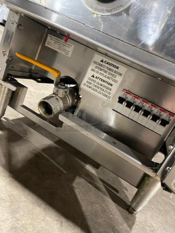 Keating 14CMBB stainless steel electric fryer with thermostat, basket hanger, backsplash, 240V 3 phase, on legs. Model SN: FE35461.