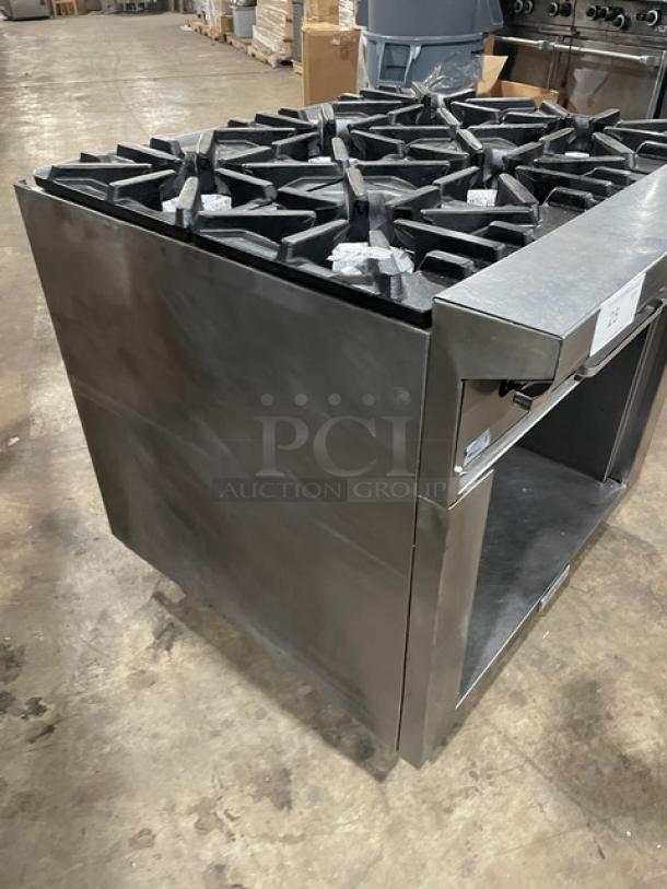 U.S. Range commercial stainless steel 6-burner natural gas range with enclosed cabinet base, on casters. Excellent condition.