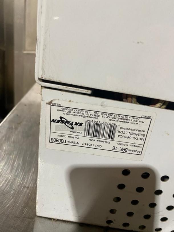 Skymsen commercial ice cream mixer, model BAK-16, stainless steel, 110/220V, serial number 000909, label visible.