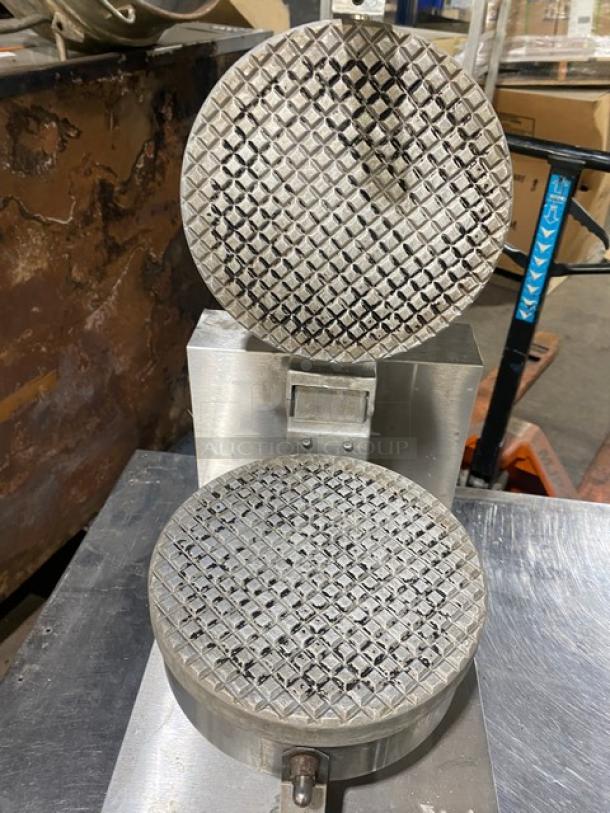 Star stainless steel electric Belgian waffle maker, commercial-grade, countertop design, visibly used condition.