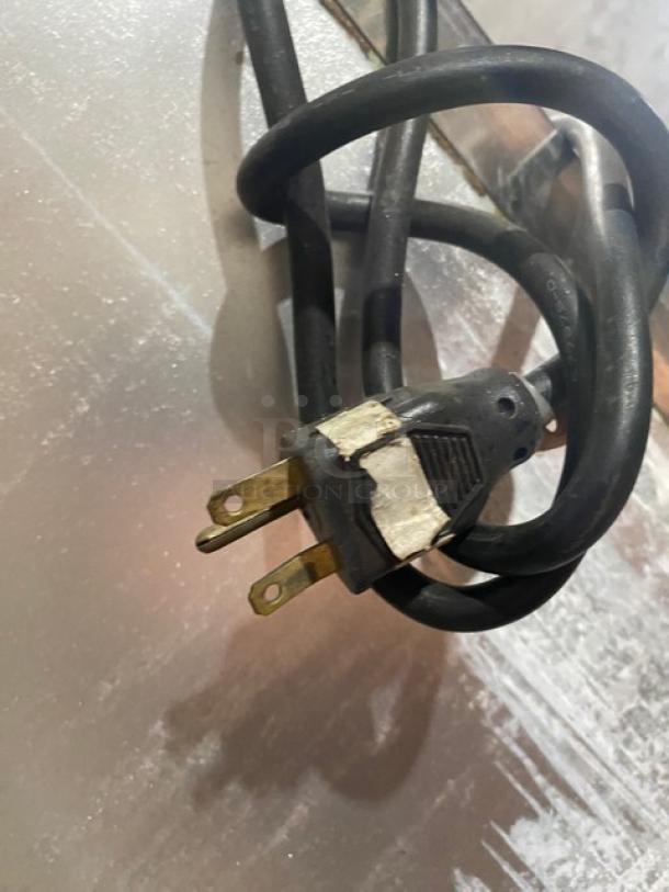Electric plug for Star stainless steel commercial Belgian waffle maker. Features durable design; shows some signs of wear.