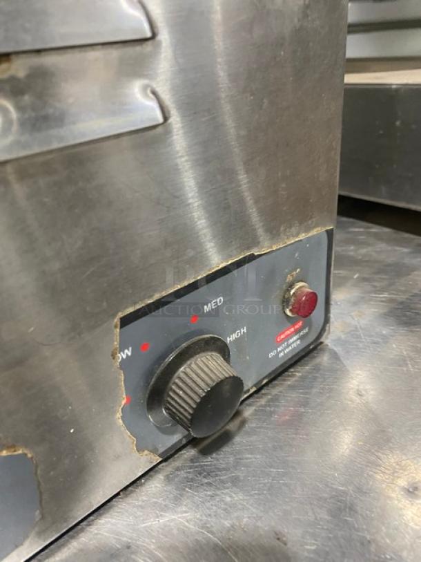 Nemco stainless steel electric countertop food warmer with single well, 120V, control dial, moderate wear.