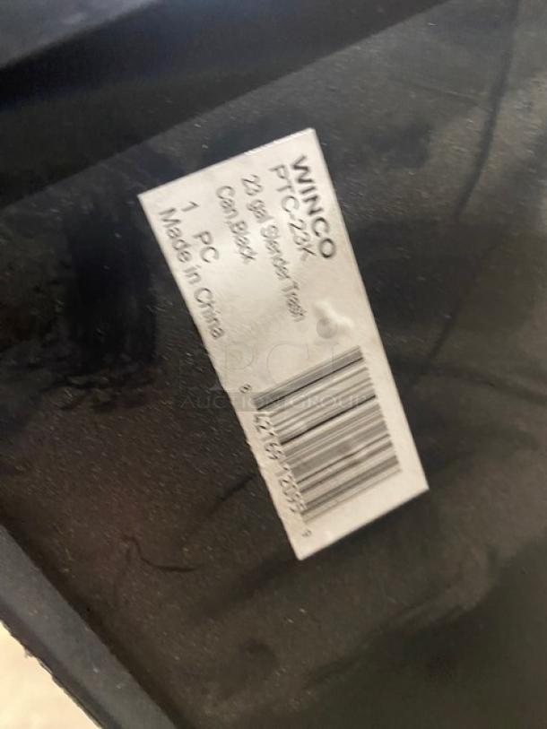 Winco Commercial Black 23 Gal. Slender Trash Can, Model PTC23K, new condition, brand label visible, made in China.