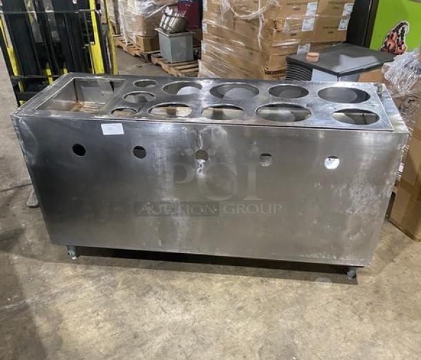 Commercial stainless steel enclosed cabinet with double shelf base, drop-in adapter plate, and drain hole, on legs.