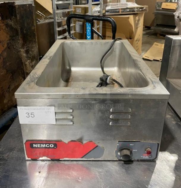 Nemco stainless steel electric food warmer, countertop single well, 120V, visible wear, labeled with Nemco brand.