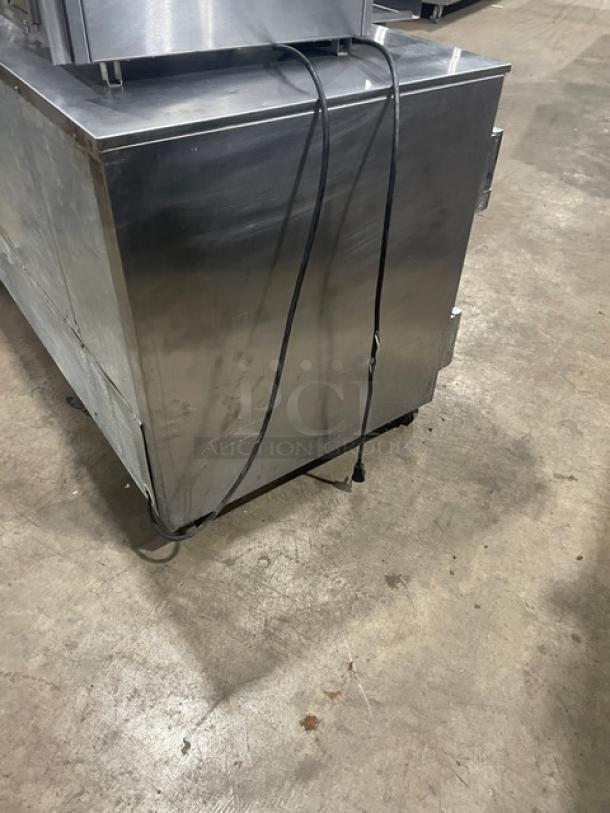 Beverage-Air UCR60A stainless steel 2-door undercounter refrigerator, 60", with poly coated wire racks, on casters.